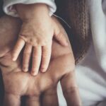 man hands child father